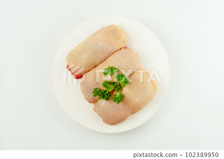 Raw fresh chicken leg meat with skin on a light background.Copy space.Food for retail.Procurement for designers.Ogranic food,healthy eating.Food concept.Top view.Chicken leg meat. Raw fresh chicken leg meat with skin on a light background.Copy space.Food for retail.Procurement for designers.Ogranic food,healthy eating.Food concept.Top view.Chicken leg meat. 102389950