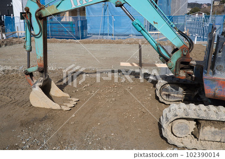 Concrete foundation for a house leveling the ground with heavy machinery 102390014