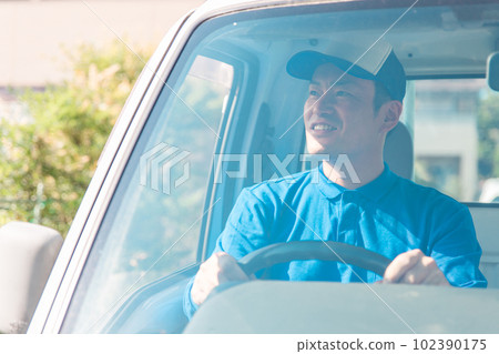 A man who drives a truck (moving, delivery, light cargo driver, home delivery, delivery person, courier service) 102390175