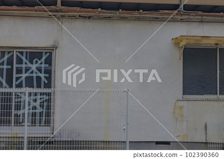 Old house and taped windows Old house and taped windows 102390360