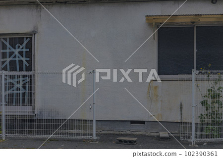 Old house and taped windows Old house and taped windows 102390361