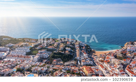 Aerial view of portuguese tourist village Carvoeiro Portugal Algarve in summer on a sunny day. Blue sea 102390659