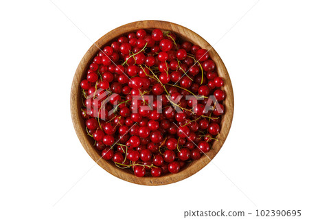 Fresh red currant in wooden bowl on dark table Fresh red currant in wooden bowl on dark table 102390695