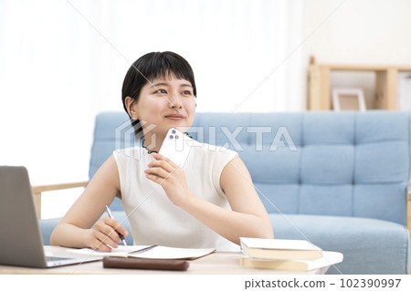 Young woman studying 102390997