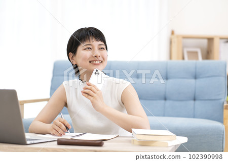 Young woman studying 102390998