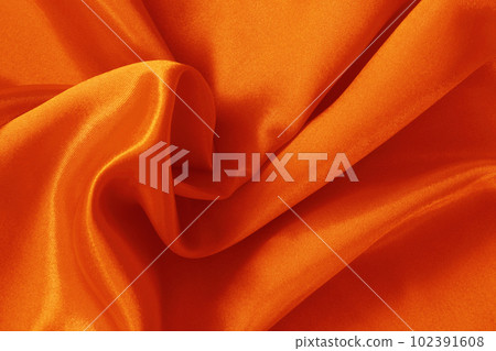 Orange fabric cloth texture for background and design art work, beautiful crumpled pattern of silk or linen. 102391608