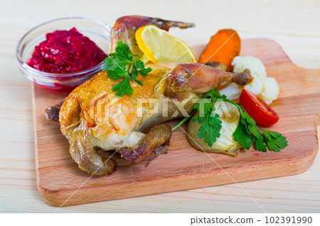 Roasted partridge with cranberry sauce Roasted partridge with cranberry sauce 102391990