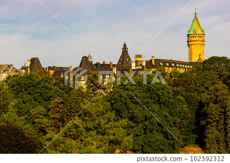 Building of Luxembourg Bank Spuerkeess behind trees Building of Luxembourg Bank Spuerkeess behind trees 102392312