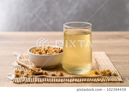 Chrysanthemum tea in glass and dry flowers, Healthy Herbal drink Chrysanthemum tea in glass and dry flowers, Healthy Herbal drink 102394439