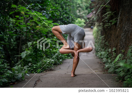 Man practice Yoga practice and meditation outdoor 102395821