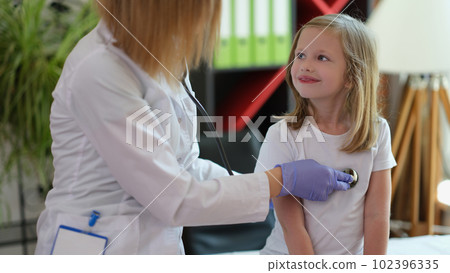 Doctor listening child breath with stethoscope, appointment with gp 102396335