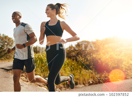 Fitness, running and health with couple in road for workout, cardio performance and summer. Marathon, exercise and teamwork with black man and woman runner in nature for sports, training and race Fitness, running and health with couple in road for workout, cardio performance and summer. Marathon, exercise and teamwork with black man and woman runner in nature for sports, training and race 102397852