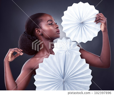 Beauty, fashion and black woman with origami, stylish and confident against a dark studio background. Female person, model or girl with trendy outfit, paper and glamour with elegant clothes and style Beauty, fashion and black woman with origami, stylish and confident against a dark studio background. Female person, model or girl with trendy outfit, paper and glamour with elegant clothes and style 102397896