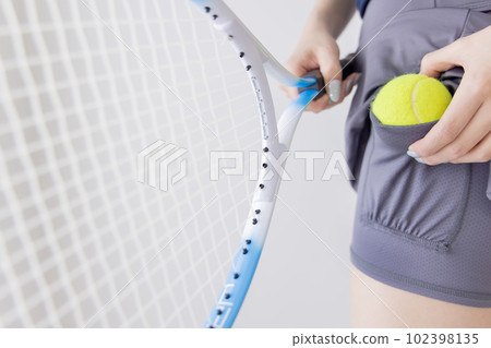 Tennis woman ball hiding place 102398135