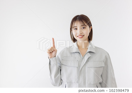 Women in work clothes to point Women in work clothes to point 102398479