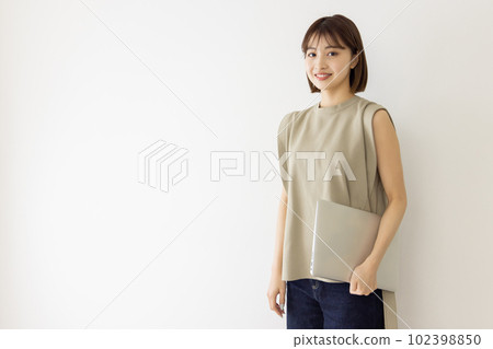 A young lady with a laptop A young lady with a laptop 102398850