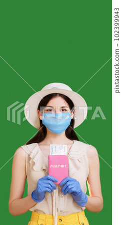 Pandemic travel. Summer vacation. Satisfied woman in medical mask gloves holding passport tickets documents traveling abroad isolated green copy space background. 102399943