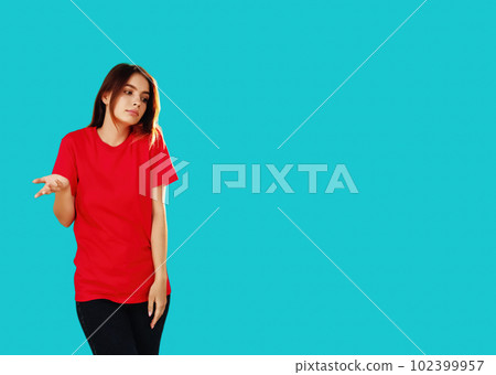 Whatever gesture. Clueless woman. No idea. Overwhelmed girl in red T-shirt doubtful expression shrugging shoulders isolated on cyan blue empty space background. Whatever gesture. Clueless woman. No idea. Overwhelmed girl in red T-shirt doubtful expression shrugging shoulders isolated on cyan blue empty space background. 102399957