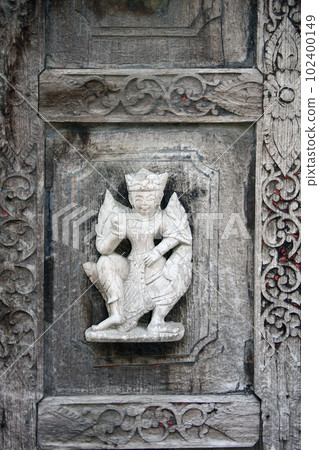 Detail of ancient wooden carved wall ornament with a mythical hero, Shwenandaw monastery (Golden Palace Monastery), Myanmar, Indochina Detail of ancient wooden carved wall ornament with a mythical hero, Shwenandaw monastery (Golden Palace Monastery), Myanmar, Indochina 102400149