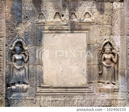 Decorative frame with wall carving ornament and figurine of  woman dancer apsara in Nokor Bachey Pagoda, Kampong Cham, Cambodia. Mock up template. Copy space for text 102400150