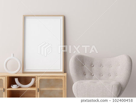 Blank vertical picture frame mockup in room. Contemporary, modern style. Empty space for artwork, poster. Armchair, sideboard, vase. Wooden frame mock up, template. Close up view. 3D rendering. 102400458