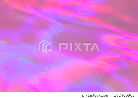Blurred pastel neon pink, purple, blue, orange holographic foil background Blurred pastel neon pink, purple, blue, orange holographic foil background 102400905