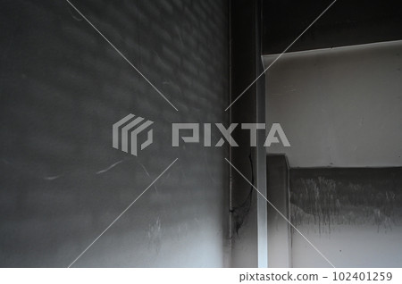 dirty black wall was burn from fire, construction industry 102401259