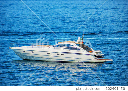 Luxury Motor Boat Moored in the Mediterranean Sea - Liguria Italy Luxury Motor Boat Moored in the Mediterranean Sea - Liguria Italy 102401450