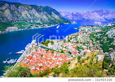 Kotor, Montenegro. Scenit sparkling Bay of Kotor, medieval walled city. 102403100