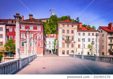 Ljublijana, Slovenia. Cobblers' Bridge, picturesque pedestrian bridge and view of the Castle. Ljublijana, Slovenia. Cobblers' Bridge, picturesque pedestrian bridge and view of the Castle. 102403170