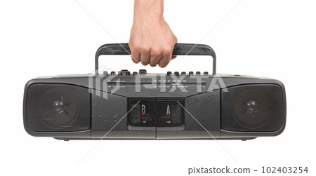 Old 1980s cassette deck with radio (FM and AM) and two cassette players 102403254