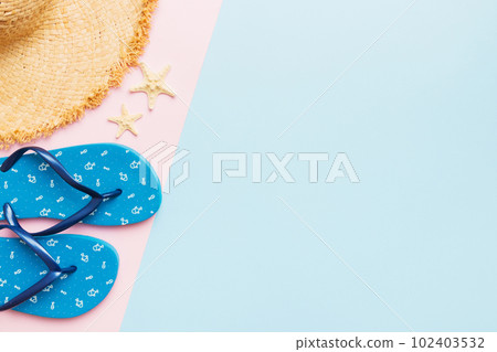 Summer vacation concept flat lay. straw hat beach accessories and flip flop top view. Space for text. travel concept Summer vacation concept flat lay. straw hat beach accessories and flip flop top view. Space for text. travel concept 102403532