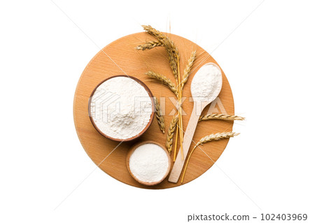 Flat lay of Wheat flour in wooden bowl with wheat spikelets isolated on white background. world wheat crisis 102403969