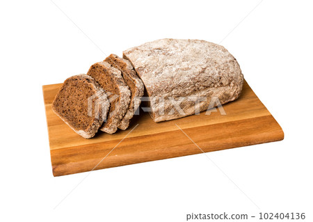 Assortment of freshly sliced baked bread with napkin isolated on white background. Healthy unleavened bread. French bread slice Assortment of freshly sliced baked bread with napkin isolated on white background. Healthy unleavened bread. French bread slice 102404136