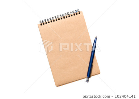 Top view of closed spiral blank recycled paper cover notebook with pencil isolated on white background Top view of closed spiral blank recycled paper cover notebook with pencil isolated on white background 102404141