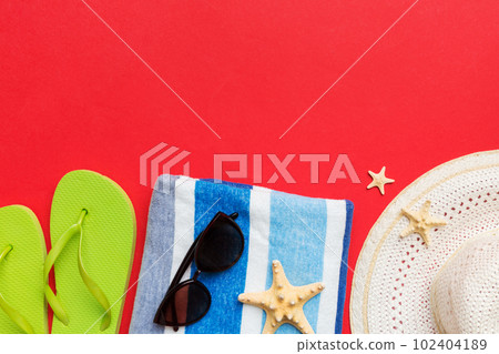 Summer vacation concept flat lay. straw hat beach accessories and towel top view. Space for text. travel concept 102404189