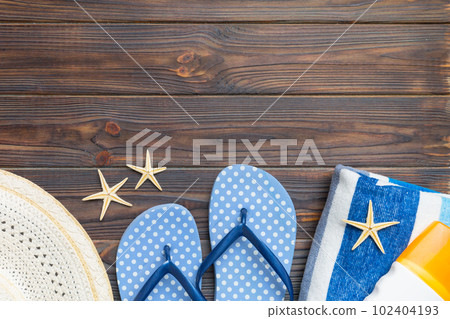 Summer vacation concept flat lay. straw hat beach accessories and towel top view. Space for text. travel concept Summer vacation concept flat lay. straw hat beach accessories and towel top view. Space for text. travel concept 102404193