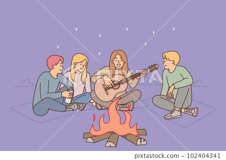 Friends are sitting around campfire with guitar enjoying camping and relaxation on evening beach Friends are sitting around campfire with guitar enjoying camping and relaxation on evening beach 102404341