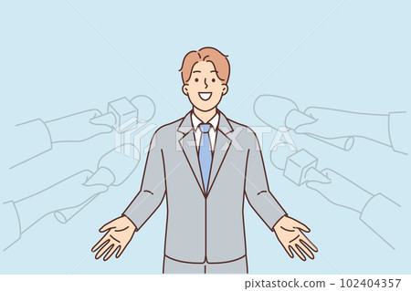 Man politician gives interview to reporters standing near hands with microphones 102404357