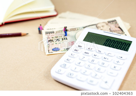 Money, calculator and miniature dolls Money, calculator and miniature dolls 102404363