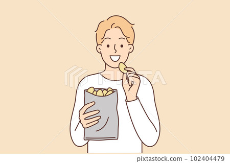 Man eats potato chips enjoying crispy high-calorie snack that quickly satisfies hunger Man eats potato chips enjoying crispy high-calorie snack that quickly satisfies hunger 102404479
