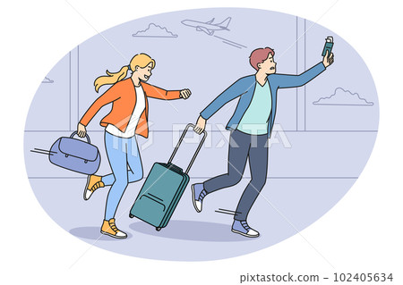 Worried tourists run for flight in airport 102405634