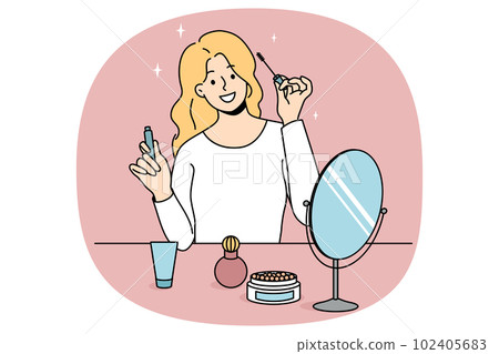 Smiling girl doing makeup looking in mirror Smiling girl doing makeup looking in mirror 102405683