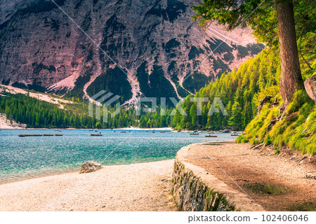 Lago di Braies, Crystal-clear lake in the Dolomites, Italy surrounded by majestic peaks. Lago di Braies, Crystal-clear lake in the Dolomites, Italy surrounded by majestic peaks. 102406046