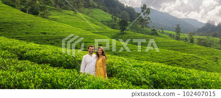 Aerial Drone View of Couple of Travelers on Green Tea Plantations Aerial Drone View of Couple of Travelers on Green Tea Plantations 102407015
