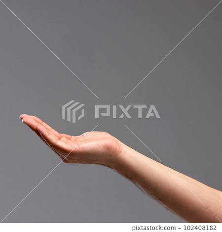 Female hand showing gesture against grey background. Playing with gestures, making figures with palms Female hand showing gesture against grey background. Playing with gestures, making figures with palms 102408182