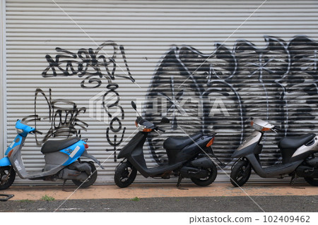 Scooter graffiti in front of the graffiti shutter Scooter graffiti in front of the graffiti shutter 102409462