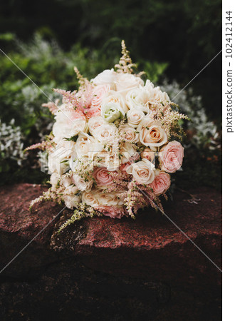 Roses in a brides flower bouquet Roses in a brides flower bouquet 102412144