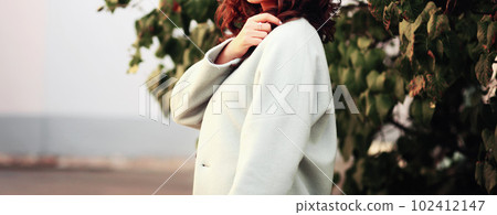Cute stylish woman standing in autumn park. Cute stylish woman standing in autumn park. 102412147