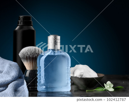 Shaving accessories set on a blue dark background mockup 102412787